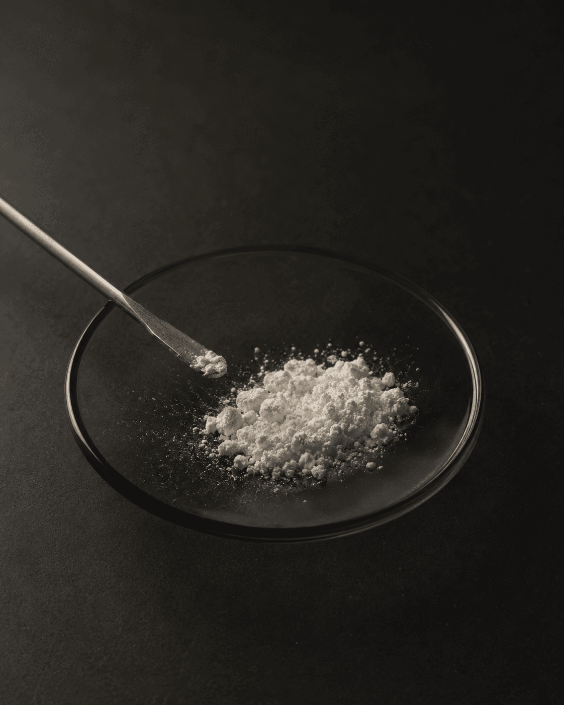 Creatine monohydrate crystal structure, photographed under dramatic lab lighting